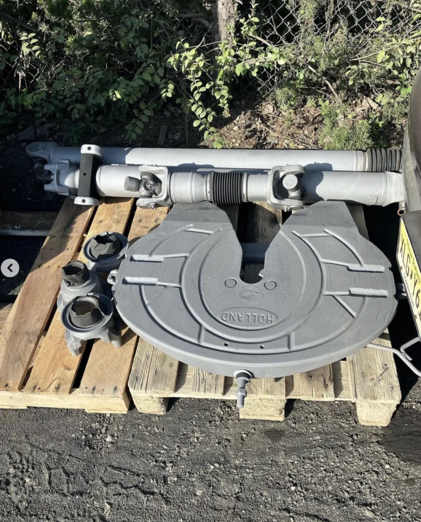 The same metal truck components after the surface has been blasted